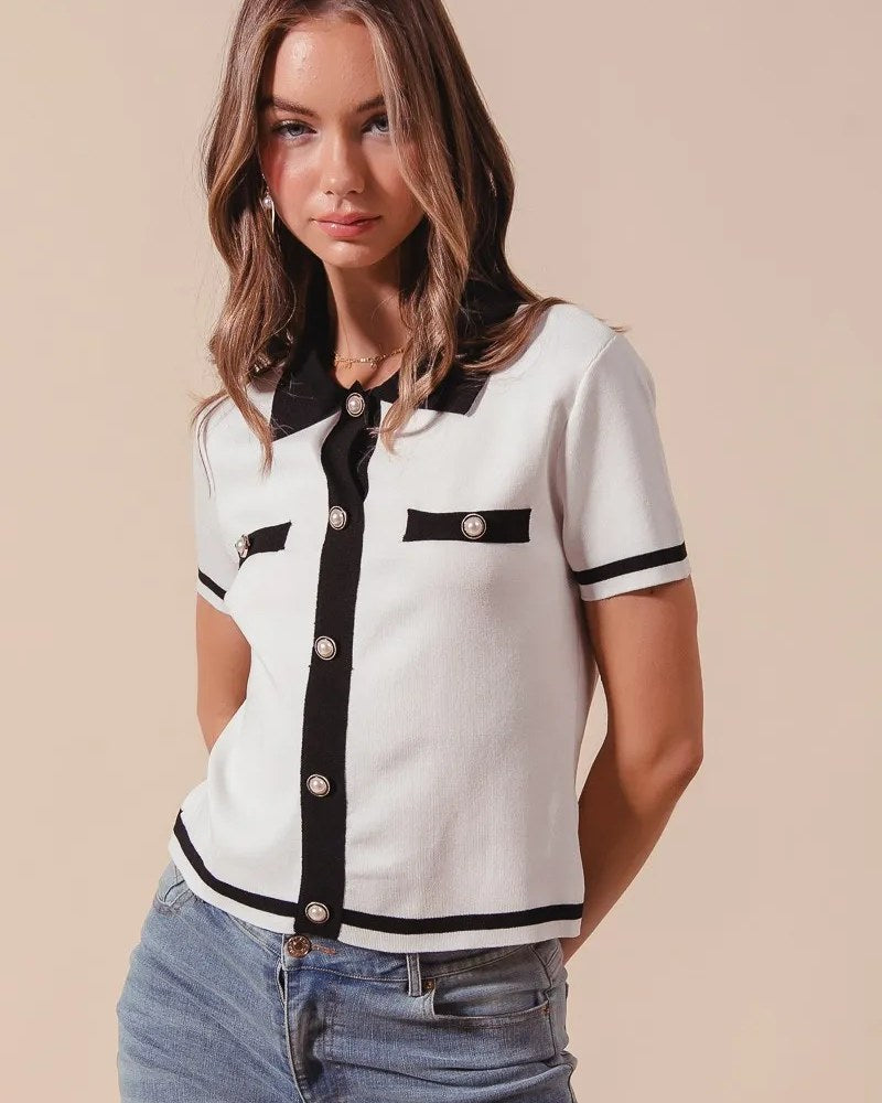 Ivory and black button-front knitted sweater top worn by a model