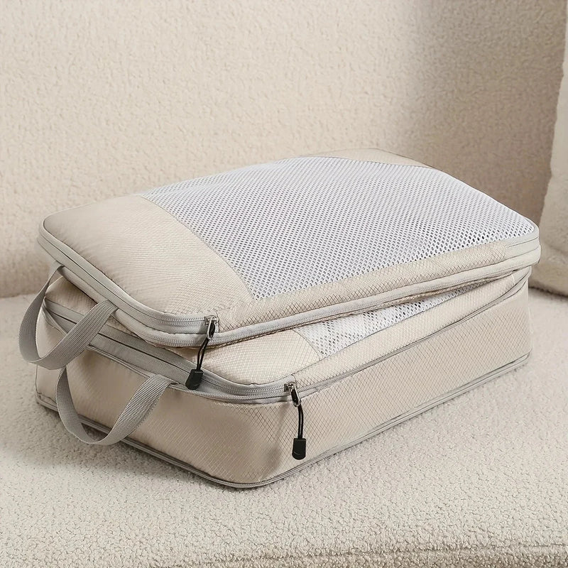 Compression Packing Cubes Set (3-Piece) — two mesh-topped packing cubes stacked on a neutral fabric surface
