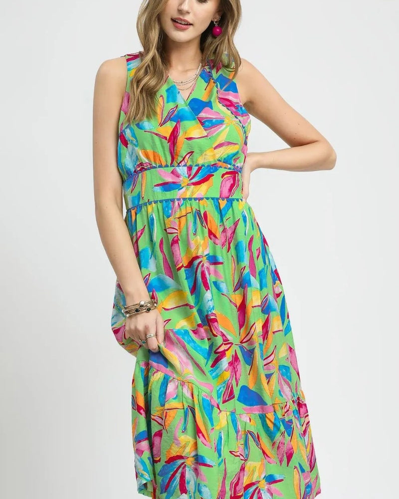 Model wearing green multicolor printed sleeveless midi dress with ruffled hem