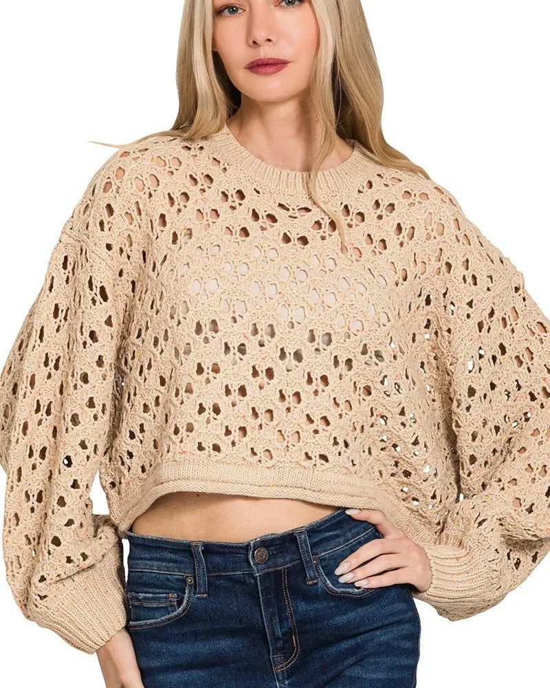 Light mocha cropped open-knit crochet sweater worn by a model