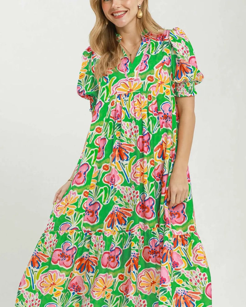 Model wearing green floral-print puff-sleeve tiered midi dress