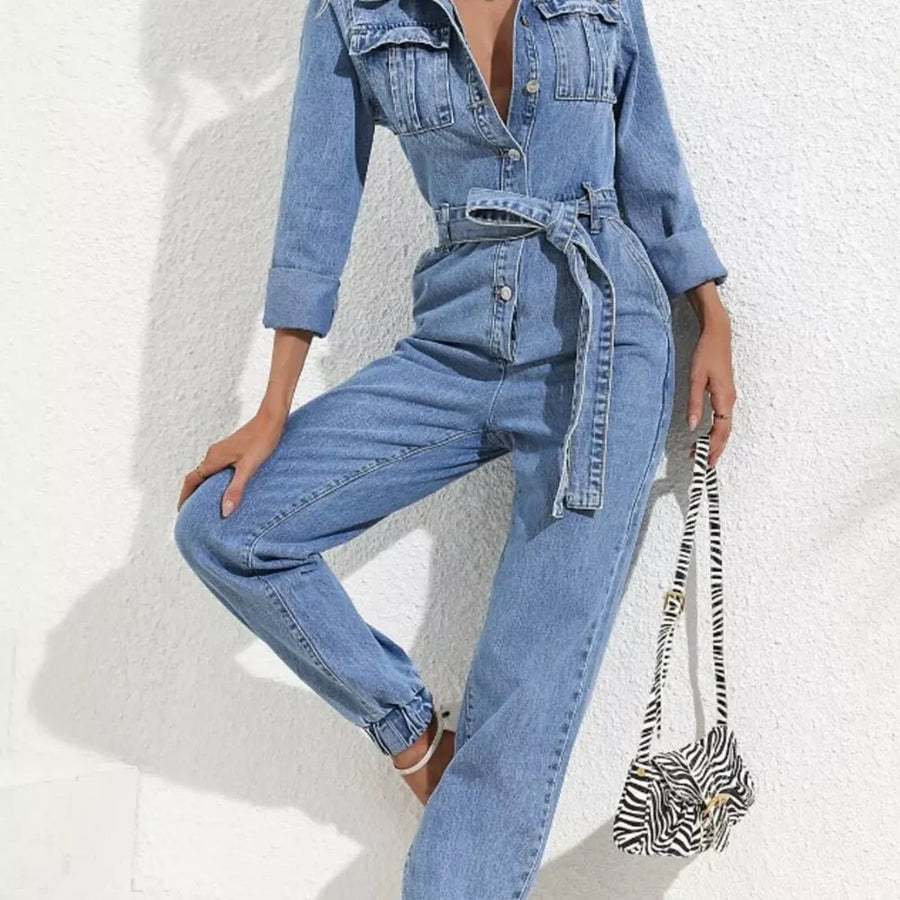 Long Sleeve Button-Up Denim Jumpsuit with Belted Waist and Elastic Cuffs — full-length view of the garment on a model