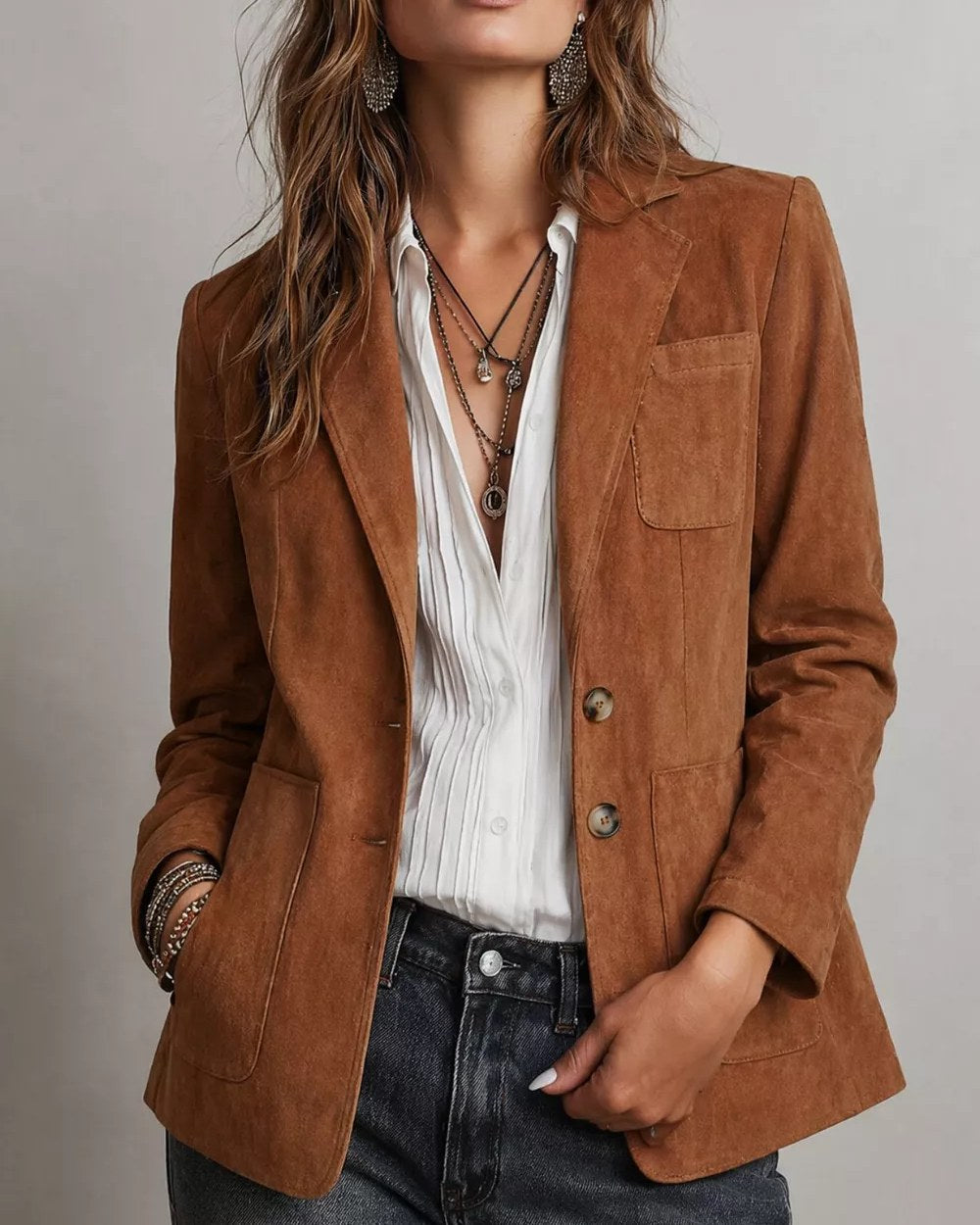 Model wearing suede-effect single-breasted blazer with front buttons