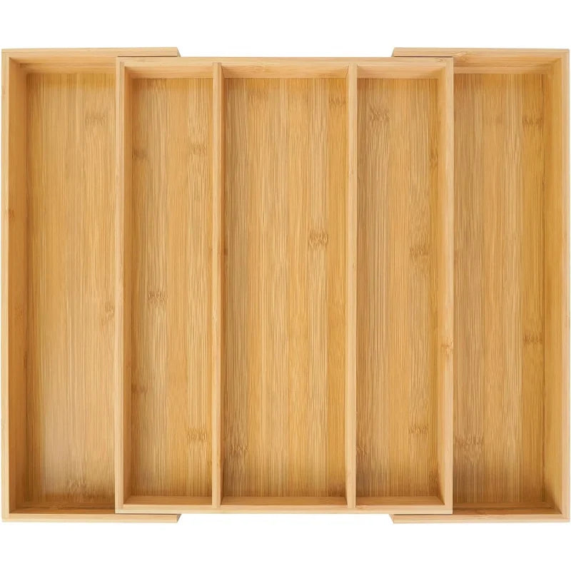 Empty expandable bamboo drawer organizer photographed from above on a white background