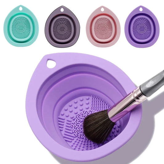 Collapsible silicone makeup brush cleaning bowl with a brush being washed in the textured bowl, shown next to the folded flat bowls